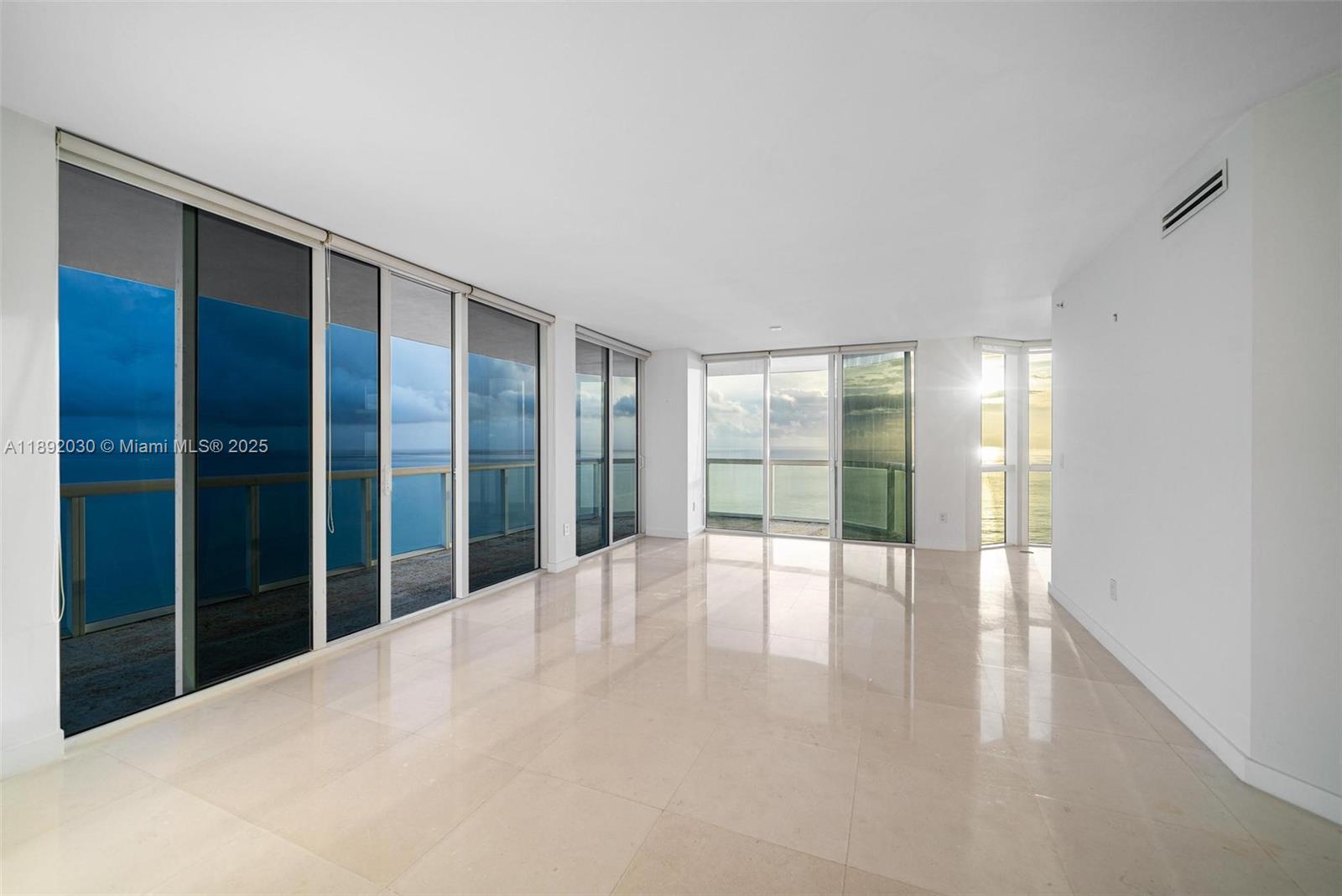 6365 Collins Avenue, Unit 2901 Miami Beach, FL 33141 - Photo 21 of 44 a view of an empty room with glass door