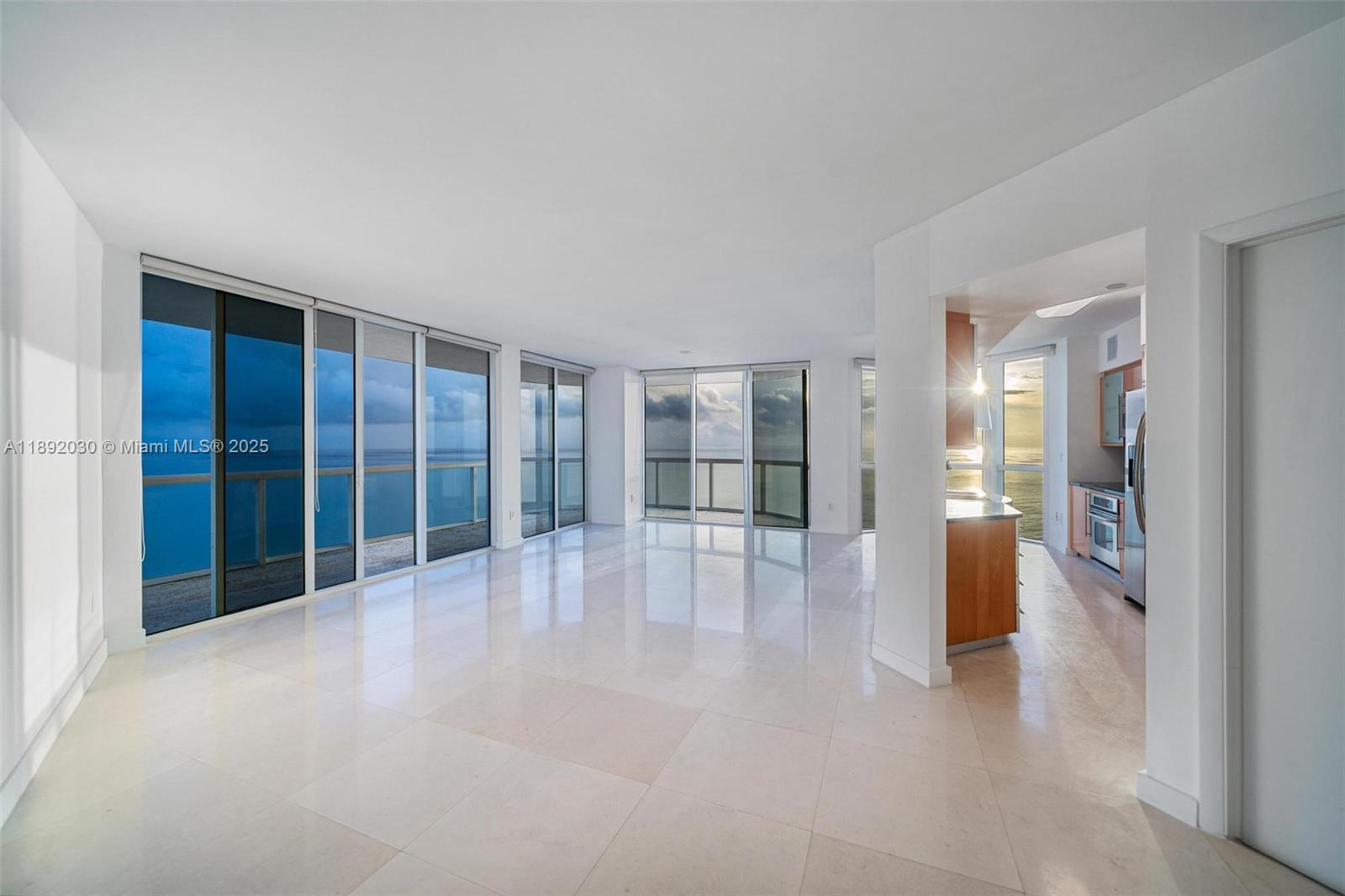 6365 Collins Avenue, Unit 2901 Miami Beach, FL 33141 - Photo 24 of 44 a view of an empty room with glass door