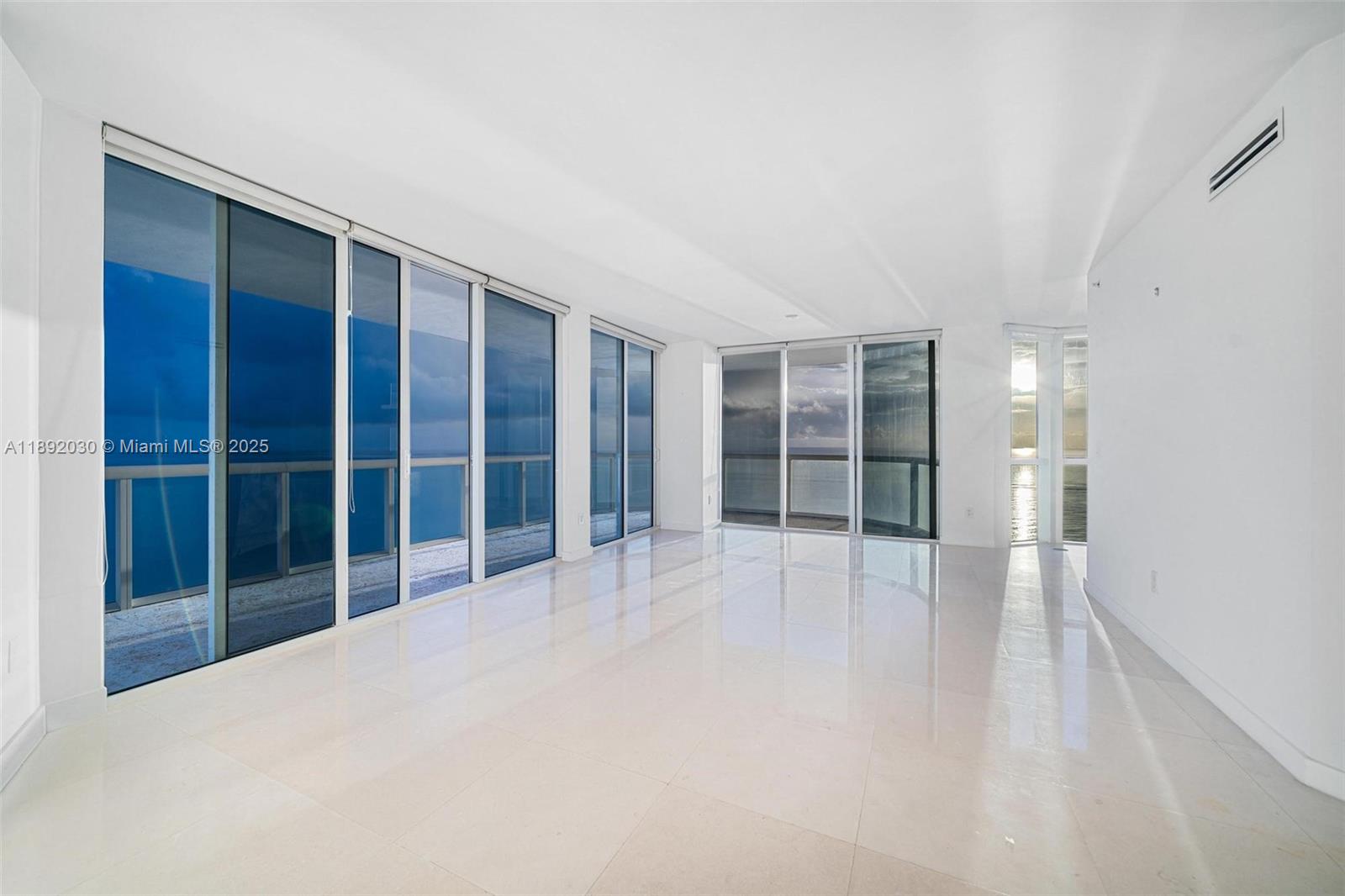 6365 Collins Avenue, Unit 2901 Miami Beach, FL 33141 - Photo 33 of 44 a view of empty room with a large window