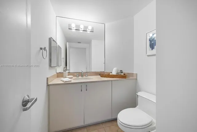 a view of an empty room with glass door