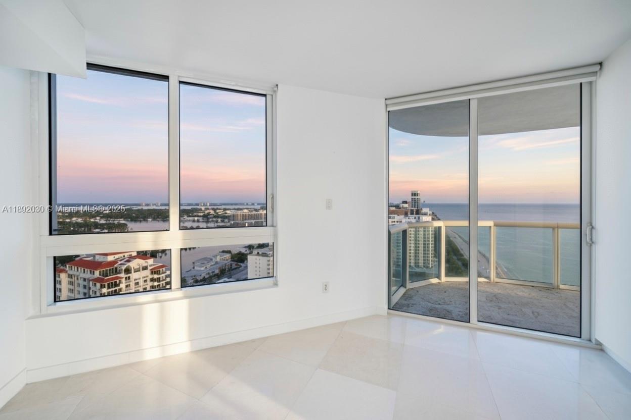 6365 Collins Avenue, Unit 2901 Miami Beach, FL 33141 - Photo 10 of 44 a view of an empty room and window