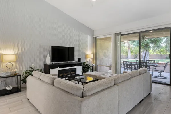 a living room with furniture and a flat screen tv