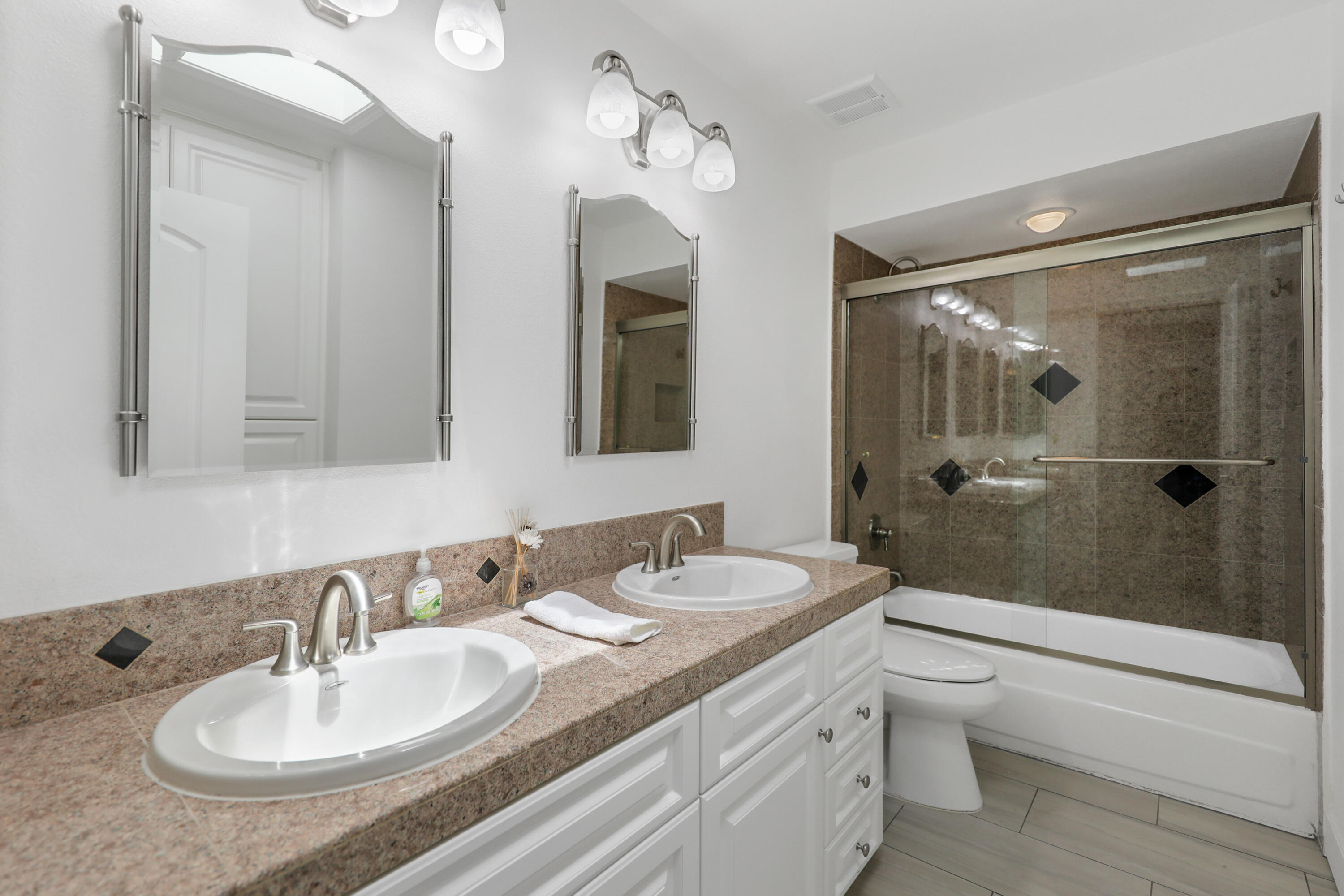 5 Majorca Drive Rancho Mirage, CA 92270 - Photo 11 of 40 a bathroom with a sink a toilet and shower