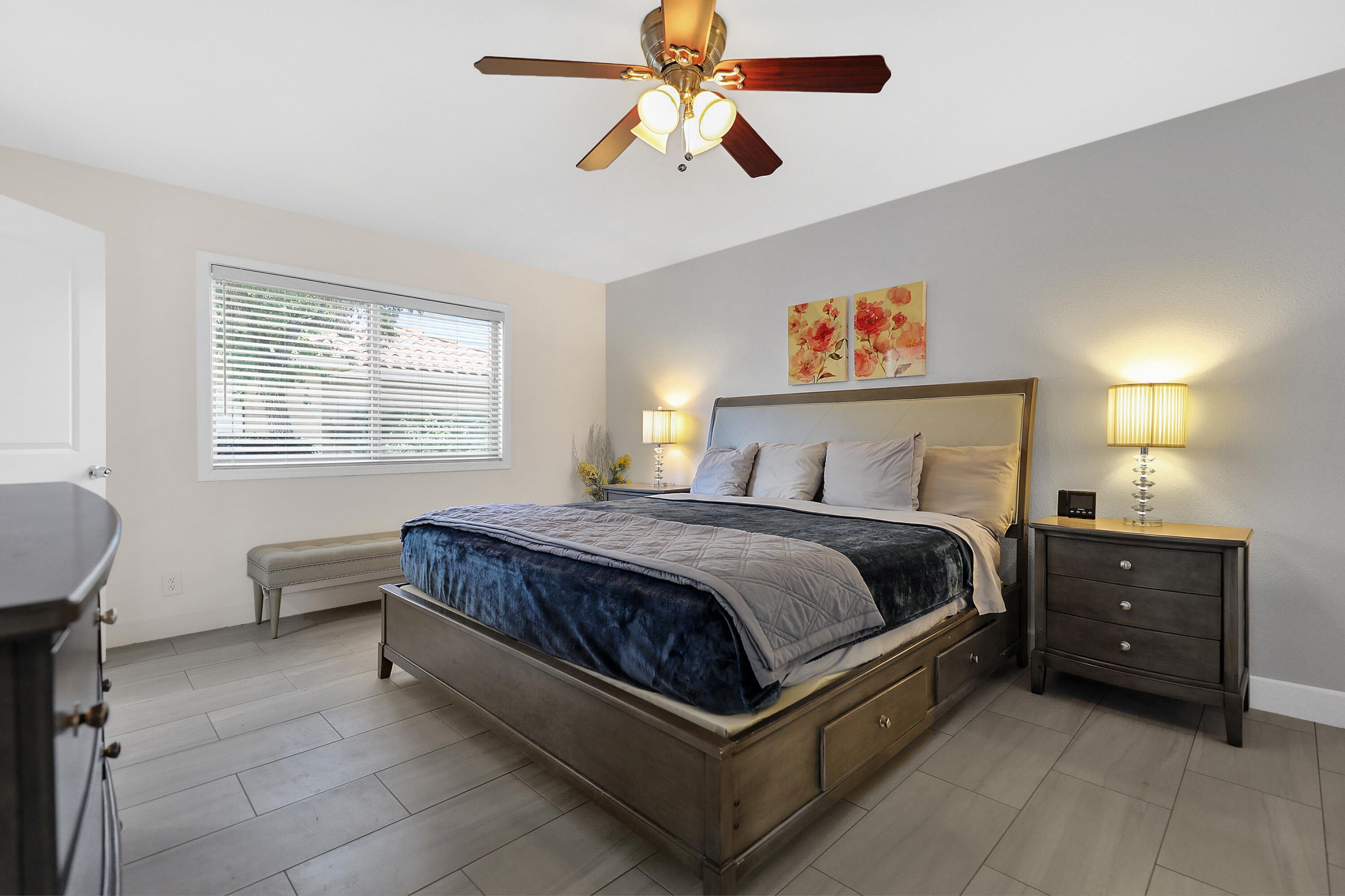 5 Majorca Drive Rancho Mirage, CA 92270 - Photo 12 of 40 a spacious bedroom with a bed and a chandelier