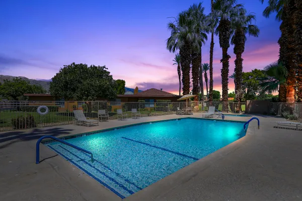 a view of a swimming pool with a lake