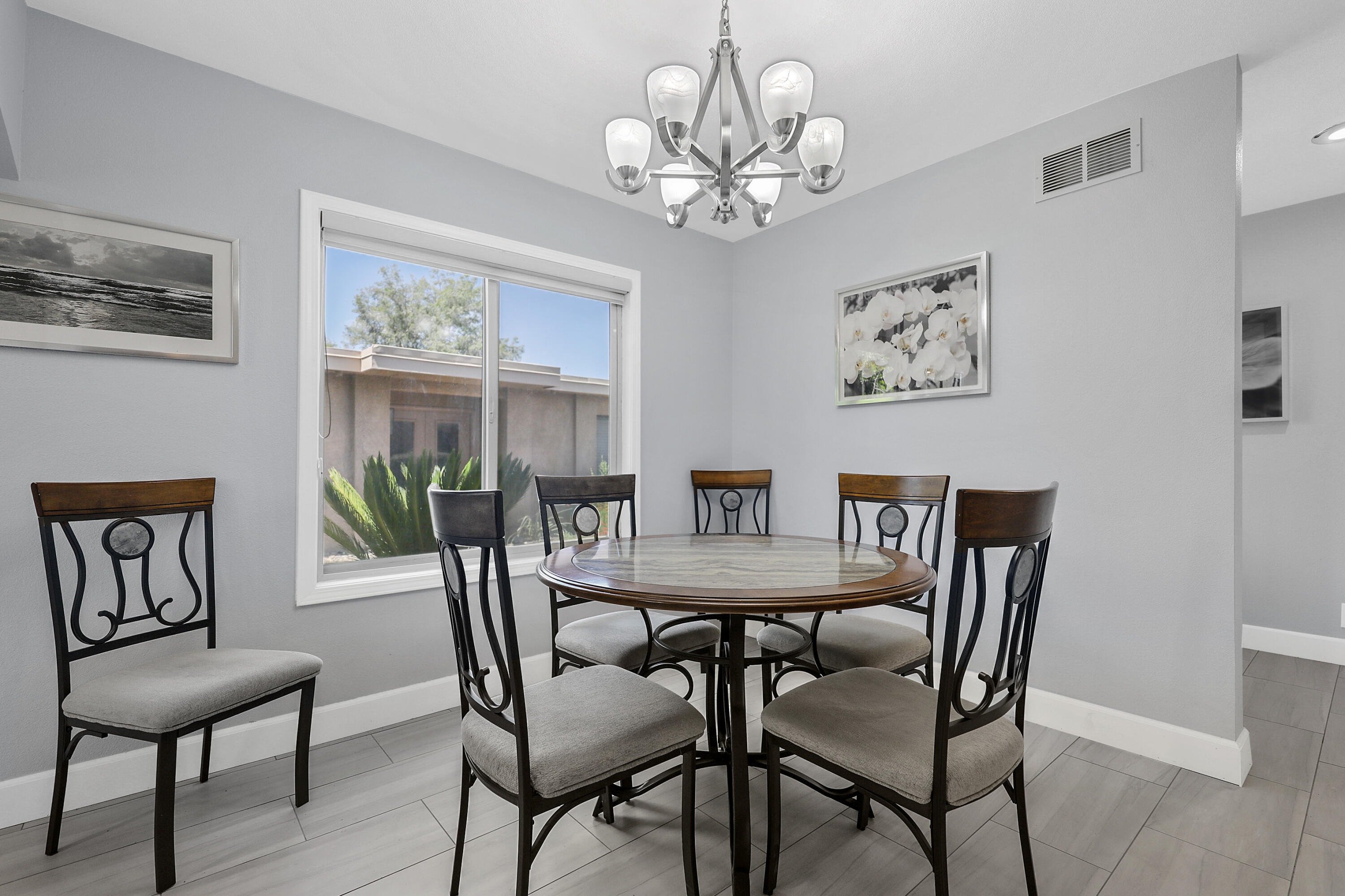 5 Majorca Drive Rancho Mirage, CA 92270 - Photo 6 of 40 a view of a dining room with furniture a chandelier and wooden floor