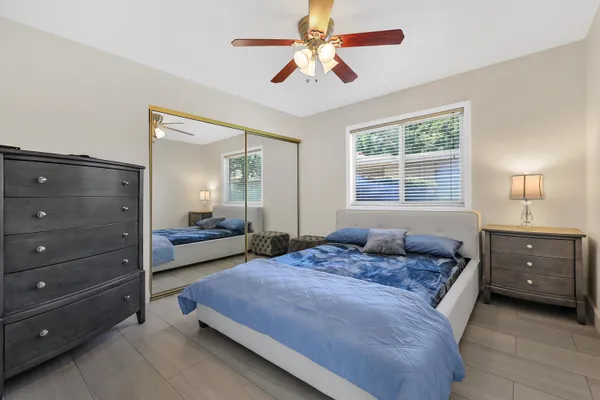 a bedroom with a bed and window