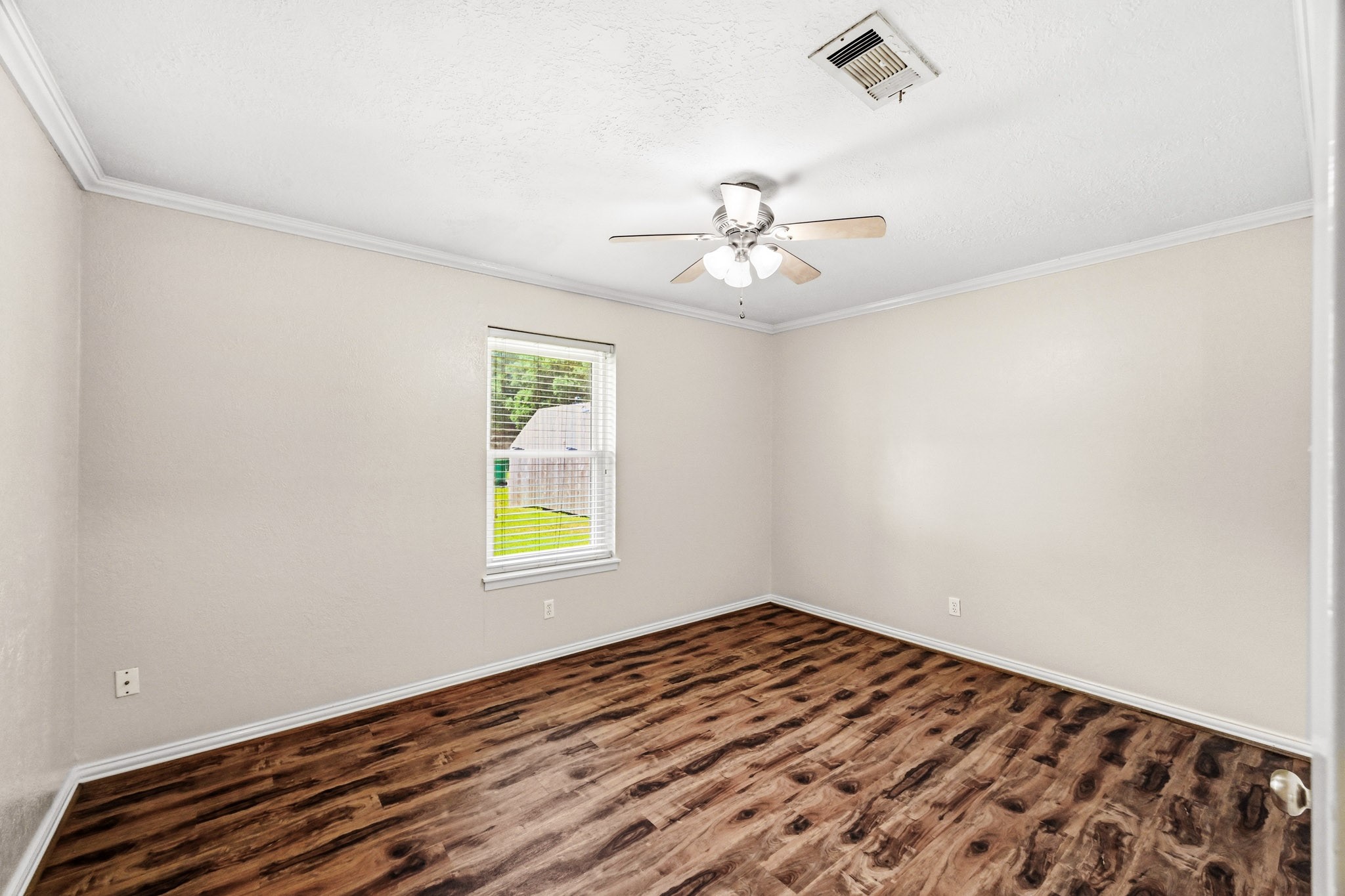 3602 Sweet Gum Spring, TX 77388 - Photo 20 of 30 wooden floor in an empty room with a window