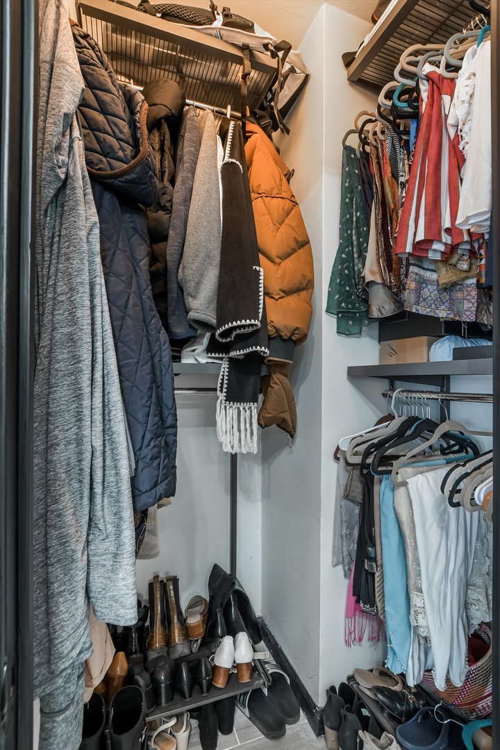 2930 North Sheridan Road, Unit 1111 Chicago, IL 60657 - Photo 17 of 28 a view of walk in closet with clothes and shoes