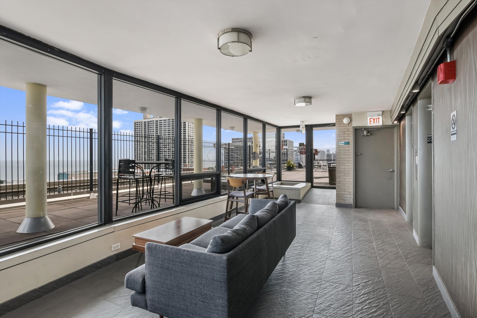 2930 North Sheridan Road, Unit 1111 Chicago, IL 60657 - Photo 19 of 28 a living room with furniture and a large window