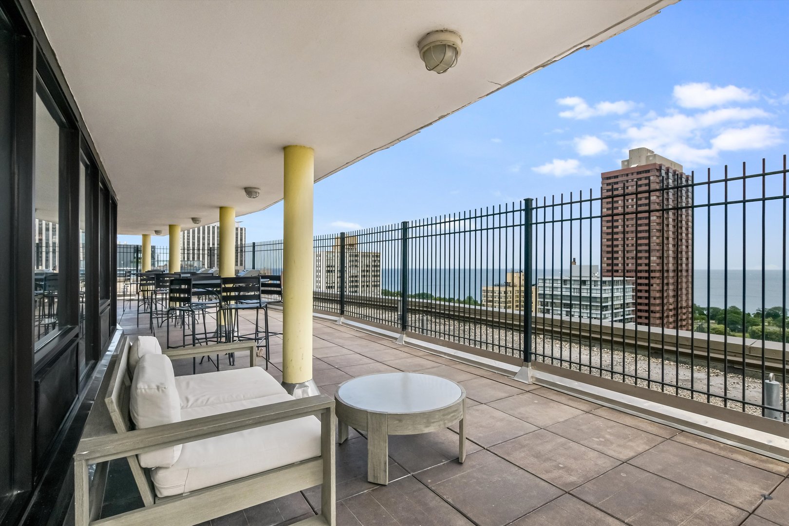 2930 North Sheridan Road, Unit 1111 Chicago, IL 60657 - Photo 20 of 28 a view of a patio with a table and chairs