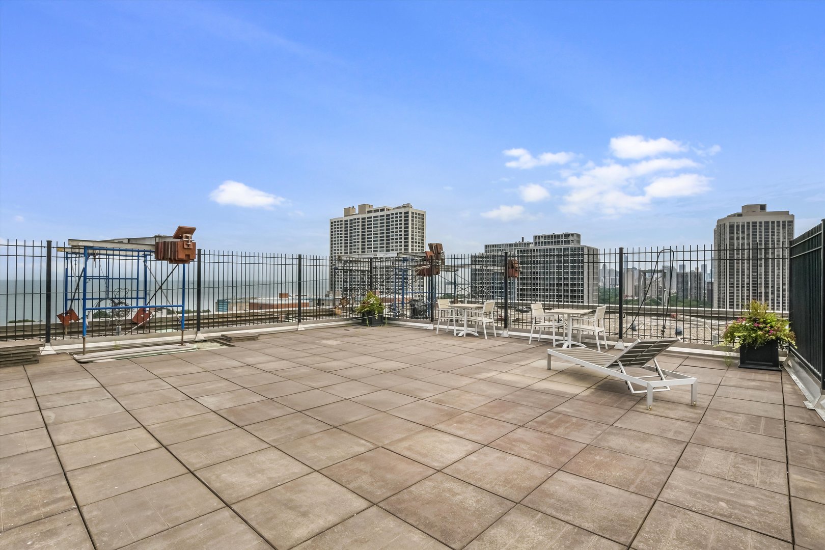 2930 North Sheridan Road, Unit 1111 Chicago, IL 60657 - Photo 24 of 28 a view of a terrace with chairs