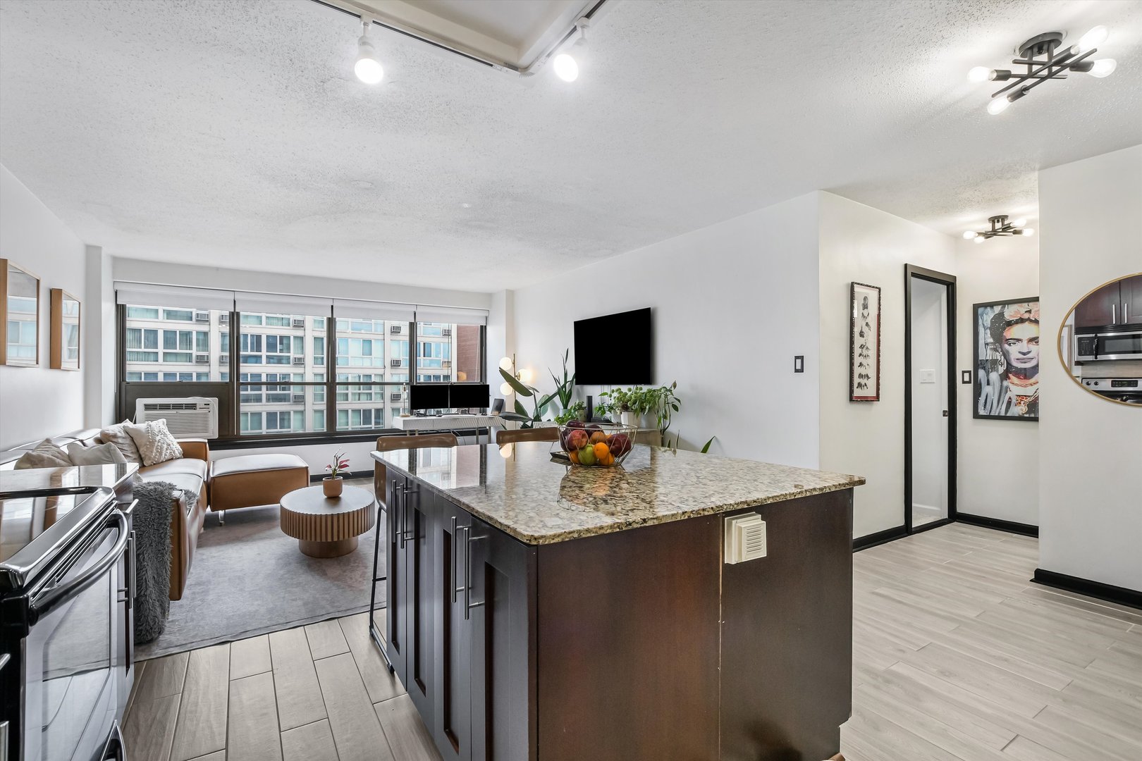 2930 North Sheridan Road, Unit 1111 Chicago, IL 60657 - Photo 6 of 28 a view of a dining room with furniture and wooden floor