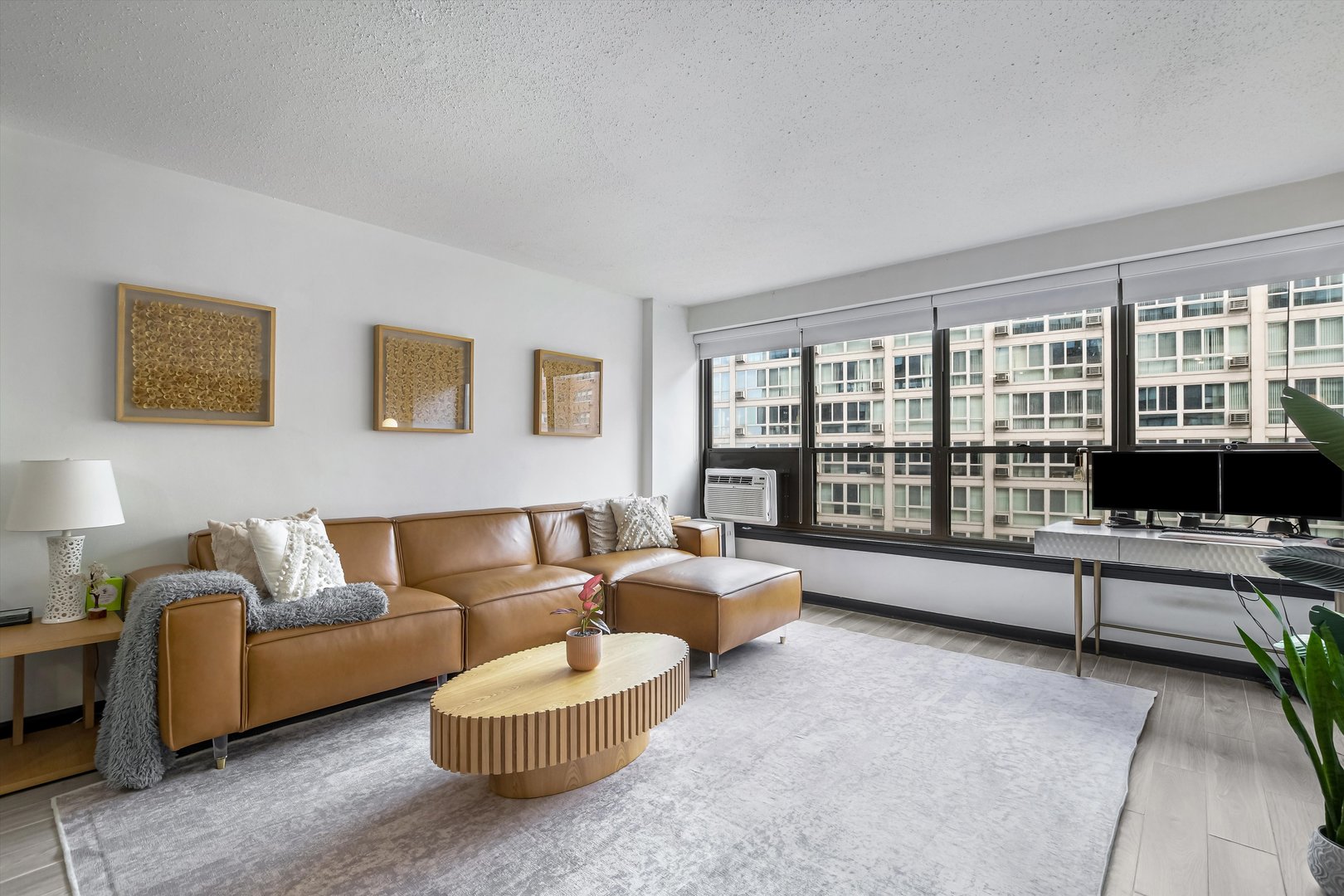 2930 North Sheridan Road, Unit 1111 Chicago, IL 60657 - Photo 8 of 28 a living room with furniture and a large window