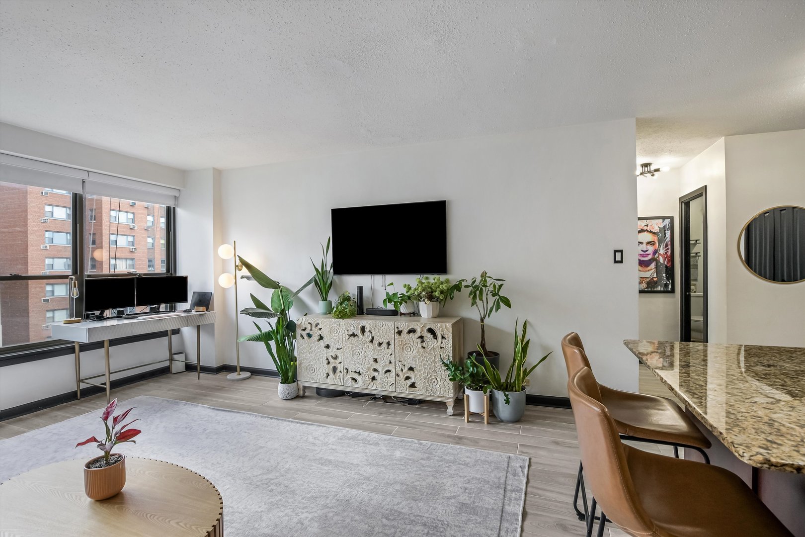 2930 North Sheridan Road, Unit 1111 Chicago, IL 60657 - Photo 9 of 28 a living room with furniture and a flat screen tv