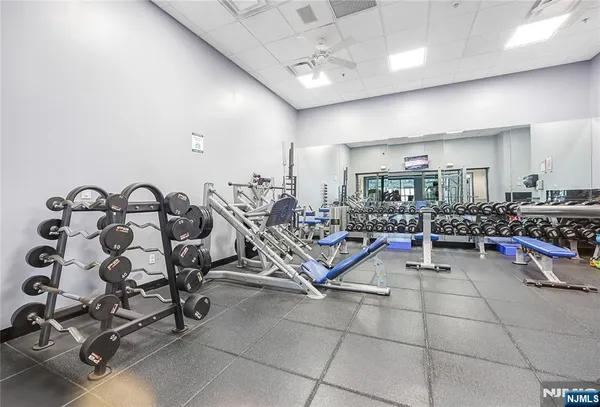 a gym room with lots of furniture and toys
