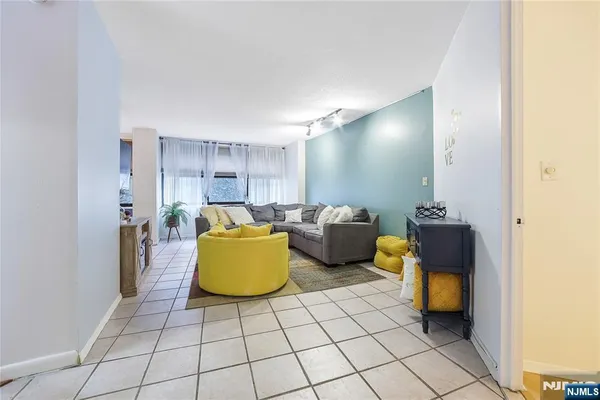 a kitchen with stainless steel appliances granite countertop a stove and a microwave