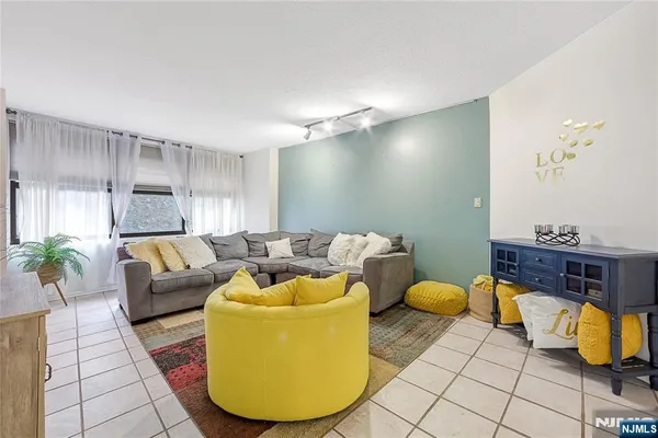a kitchen with stainless steel appliances granite countertop a stove and a microwave