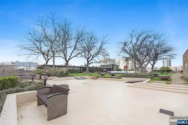 a view of outdoor space with swimming pool and lounge chair