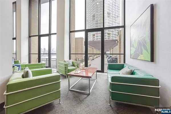 a room with furniture and pool table