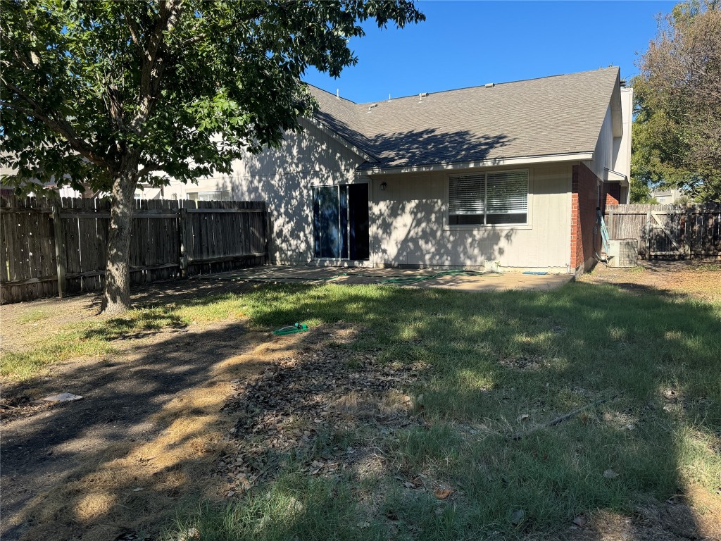 12309 Turtle Rock Road, Unit A Austin, TX 78729 - Photo 13 of 14 a view of a house with backyard and tree