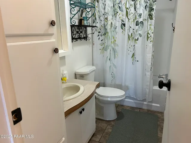 a bedroom with bed and a tv