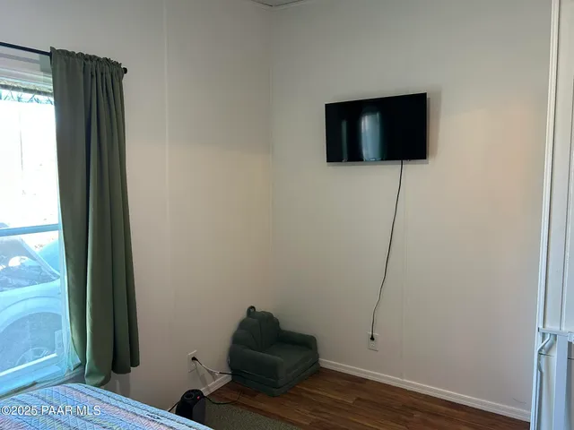 a work room with furniture and a mirror