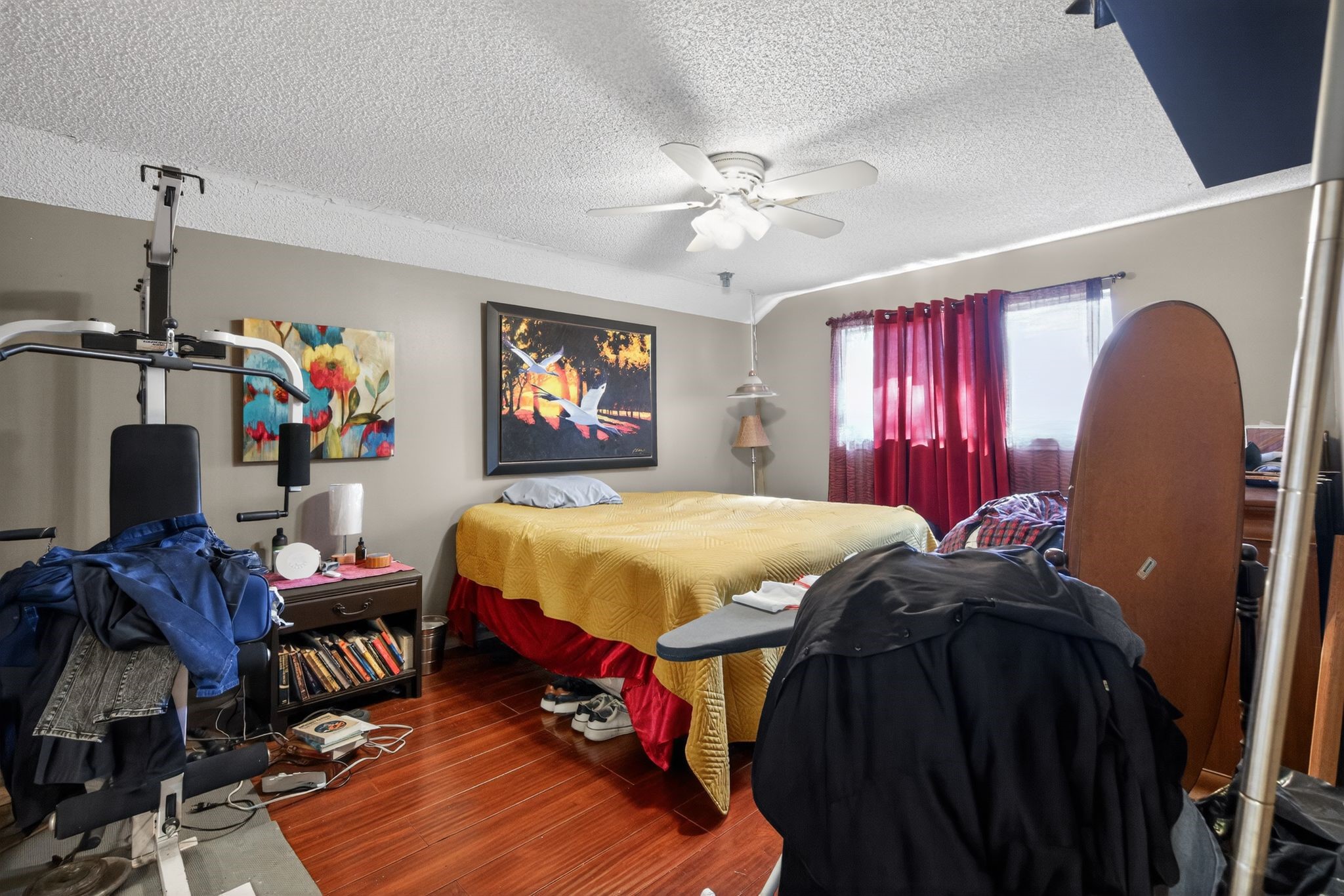 7815 Hummingbird Street Houston, TX 77071 - Photo 15 of 24 a bed room with a bed and a chandelier