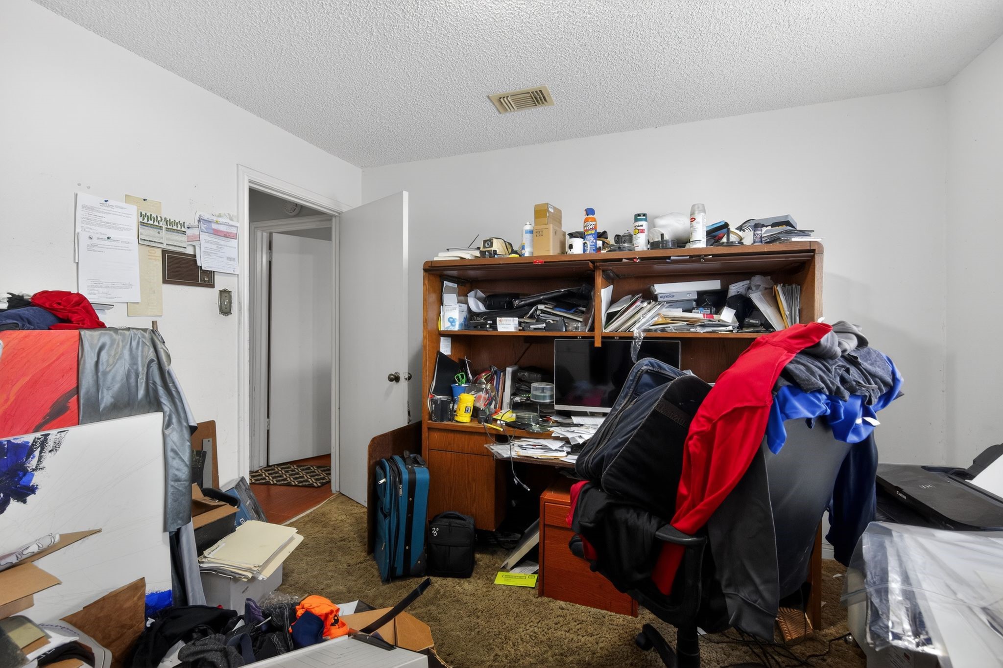 7815 Hummingbird Street Houston, TX 77071 - Photo 19 of 24 a view of walk in closet with clothes and shoes