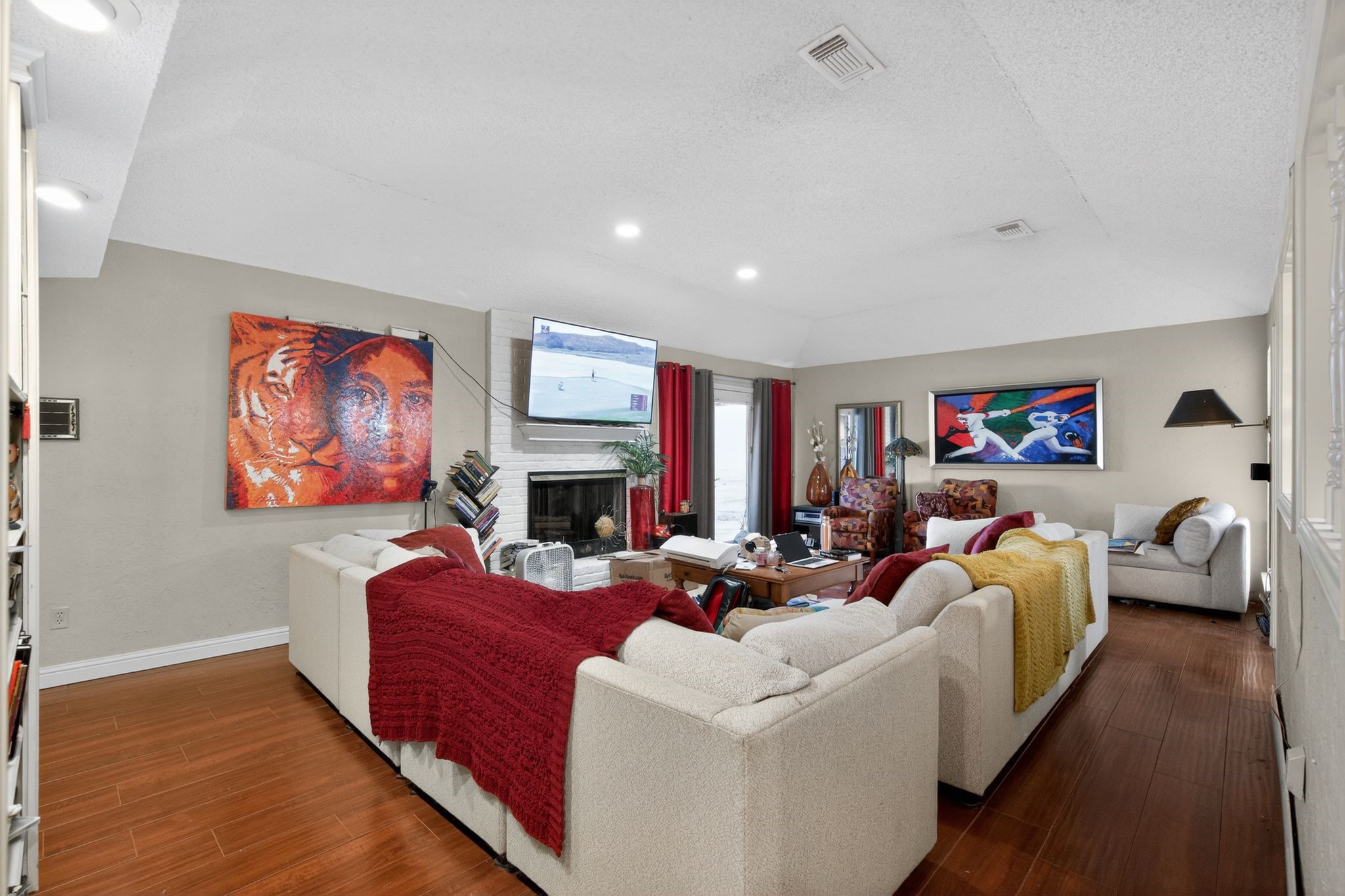 7815 Hummingbird Street Houston, TX 77071 - Photo 4 of 24 a living room with furniture fireplace and a flat screen tv