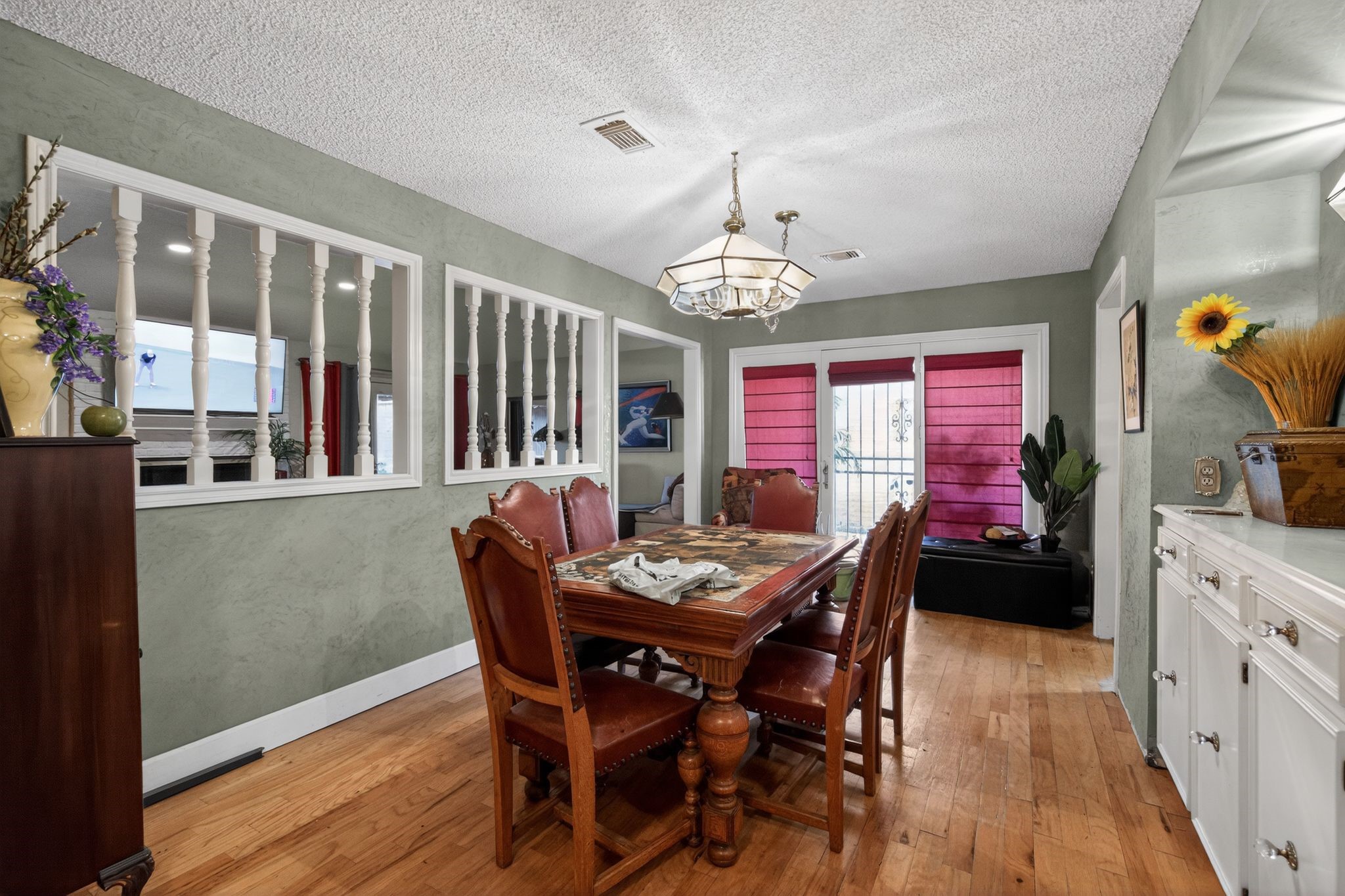 7815 Hummingbird Street Houston, TX 77071 - Photo 7 of 24 a view of a dining room with furniture window and wooden floor