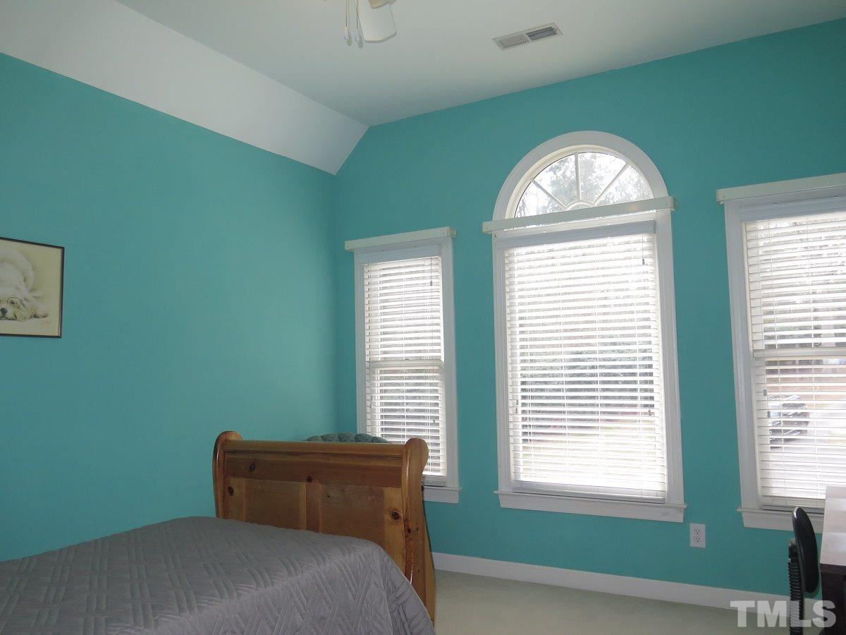11316 John Allen Road Raleigh, NC 27614 - Photo 11 of 25 a bedroom with a bed and a window