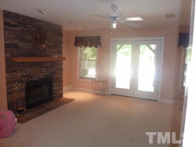 11316 John Allen Road Raleigh, NC 27614 - Photo 16 of 25 an empty room with windows and fireplace