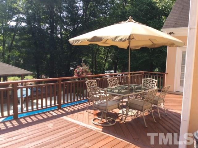 11316 John Allen Road Raleigh, NC 27614 - Photo 19 of 25 a view of balcony with wooden floor and outdoor seating