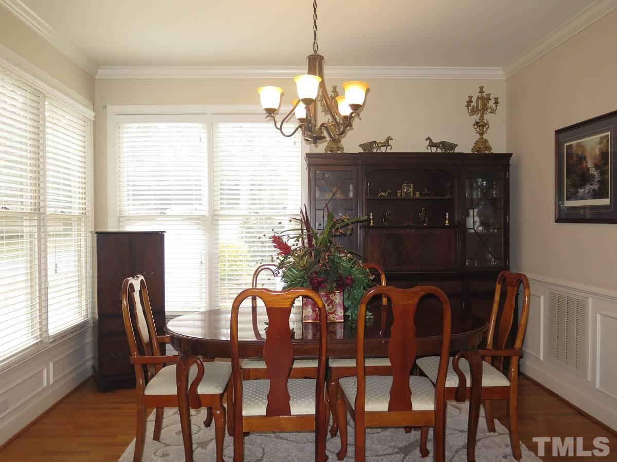 11316 John Allen Road Raleigh, NC 27614 - Photo 3 of 25 a view of a dining room with furniture and wooden floor