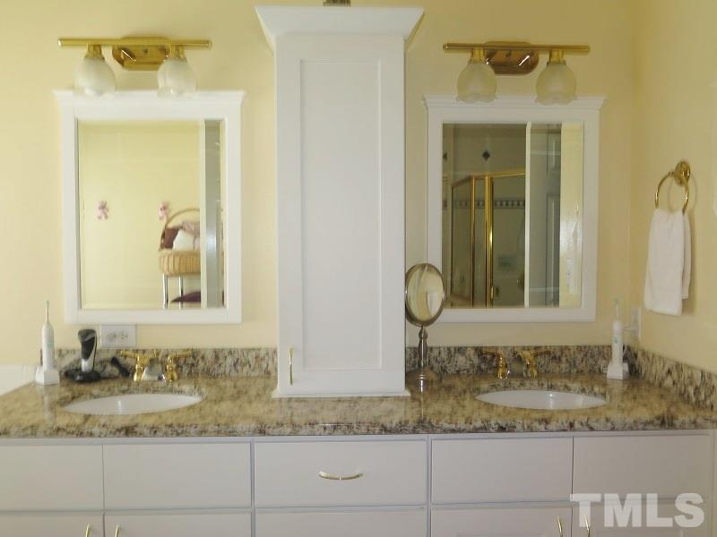 11316 John Allen Road Raleigh, NC 27614 - Photo 9 of 25 a bathroom with a granite countertop sink and a mirror