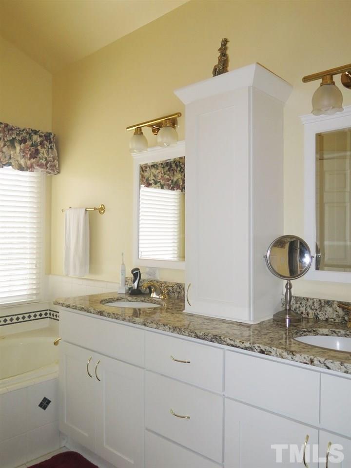 11316 John Allen Road Raleigh, NC 27614 - Photo 10 of 25 a bathroom with a granite countertop sink and a mirror