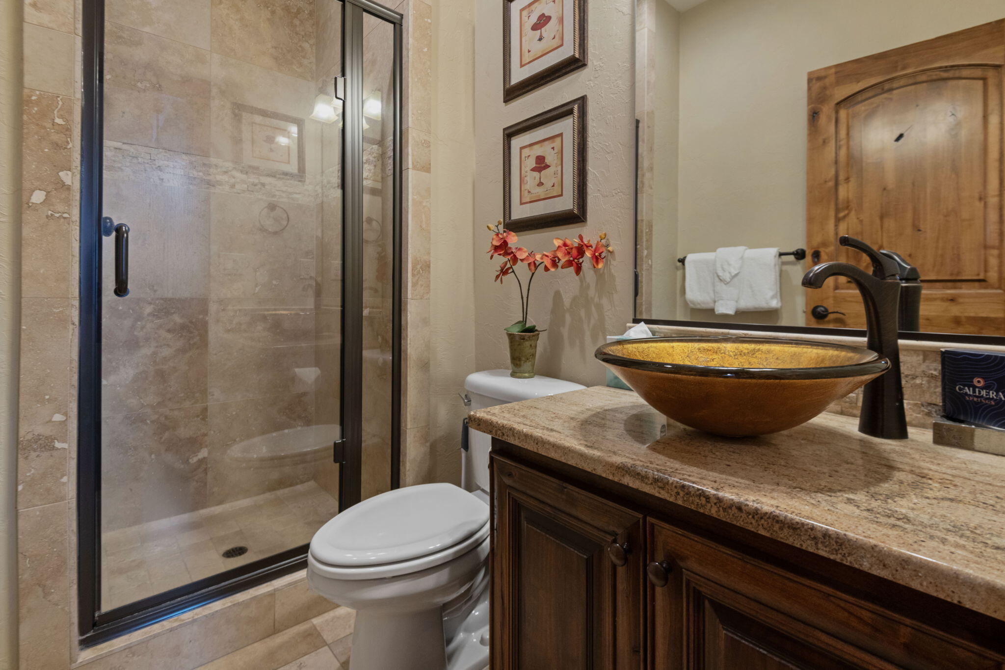 56508 Dancing Rock Loop, Unit 22 Bend, OR 97707 - Photo 24 of 69 a bathroom with a granite countertop toilet a sink and shower