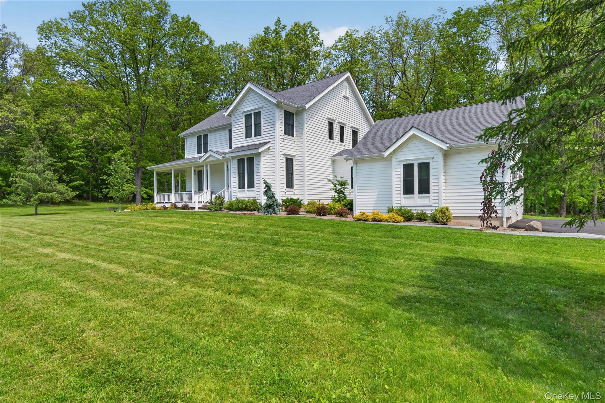 28 Bethlehem Road New Windsor, NY 12553 - Photo 6 of 50 a front view of a house with a garden and trees