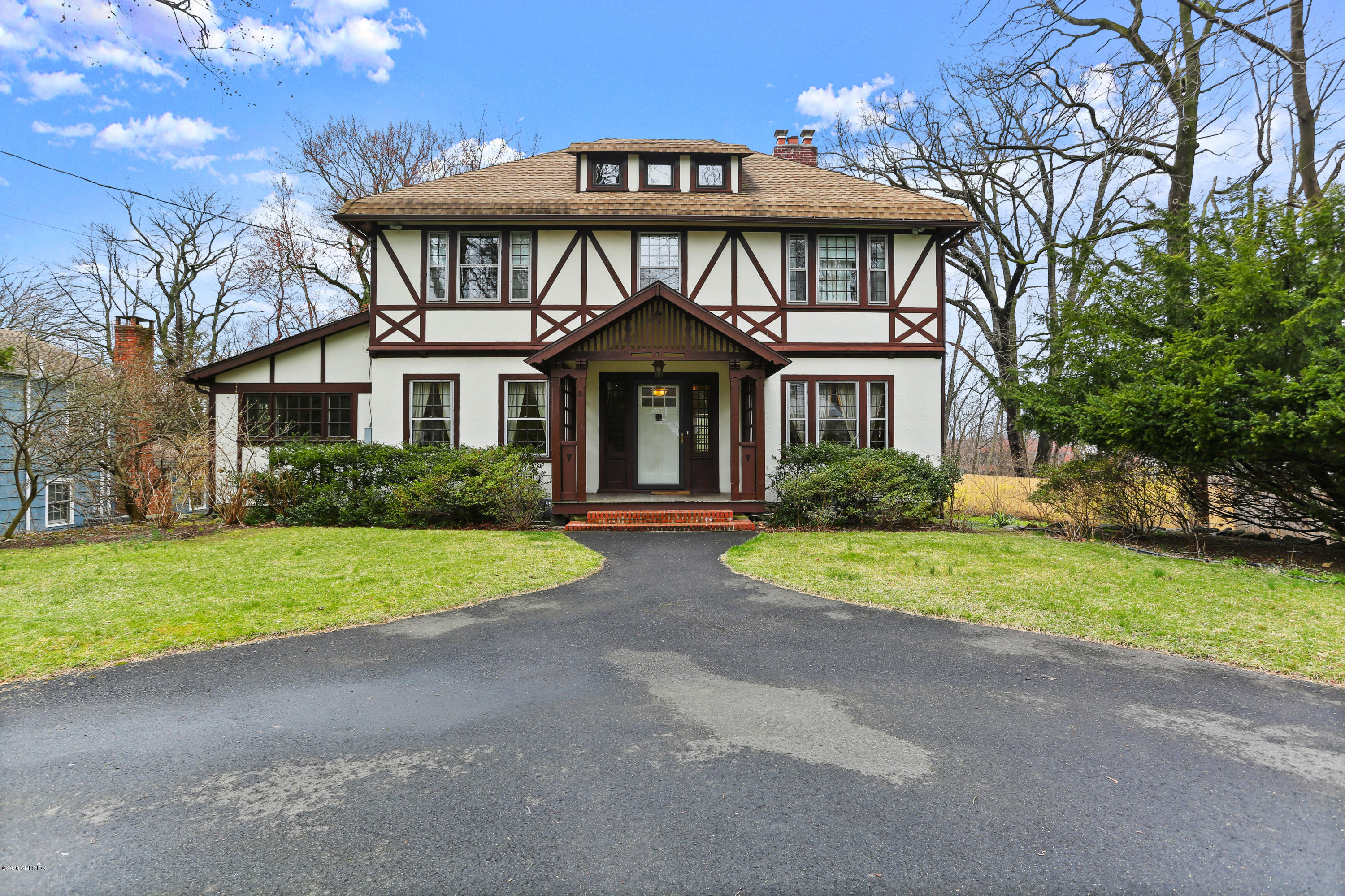 18 Leonard Avenue Riverside, CT 06878 - Photo 1 of 28 a front view of a house with a yard and garage