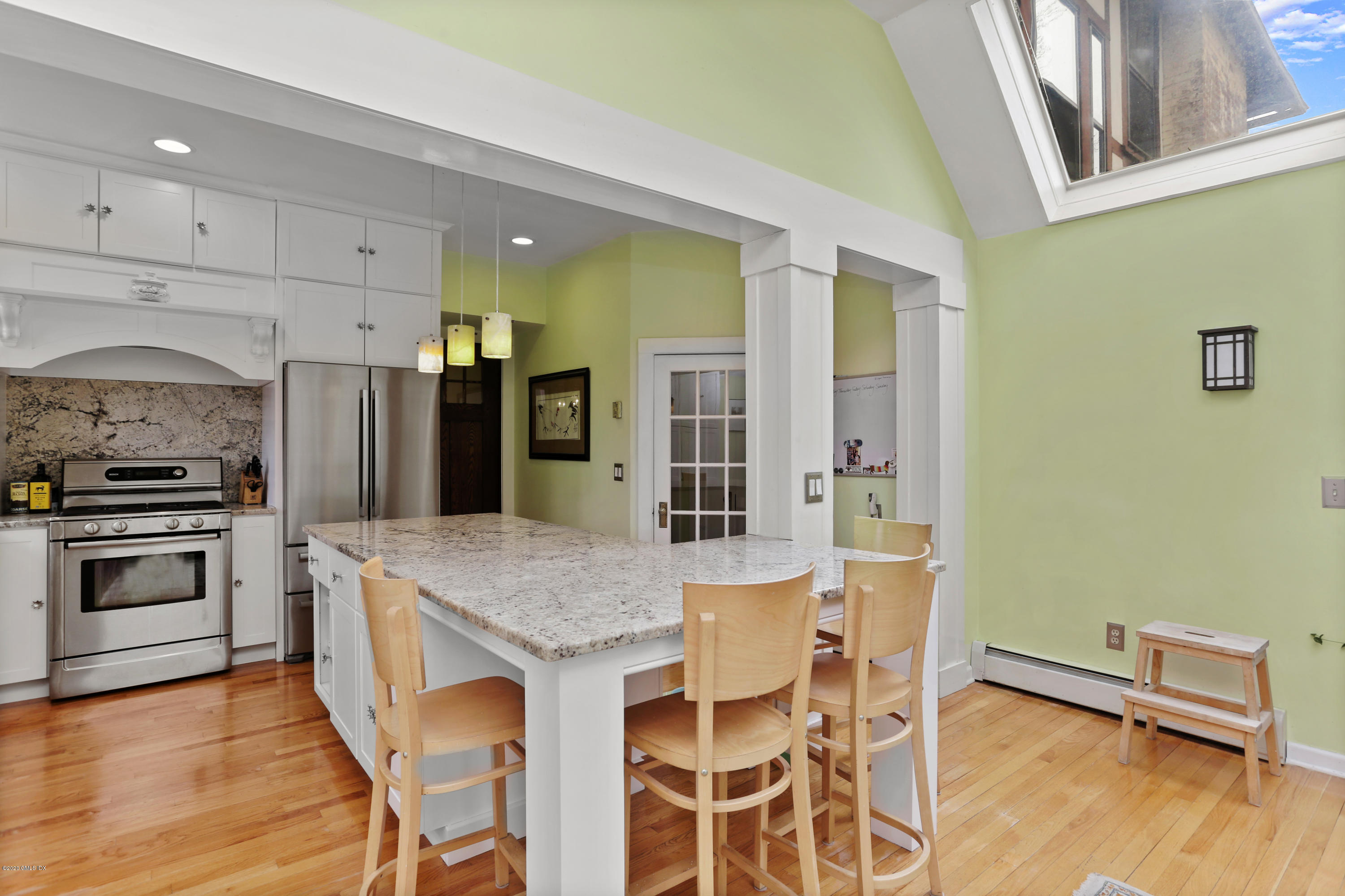 18 Leonard Avenue Riverside, CT 06878 - Photo 11 of 28 a kitchen with granite countertop a stove a sink and a refrigerator