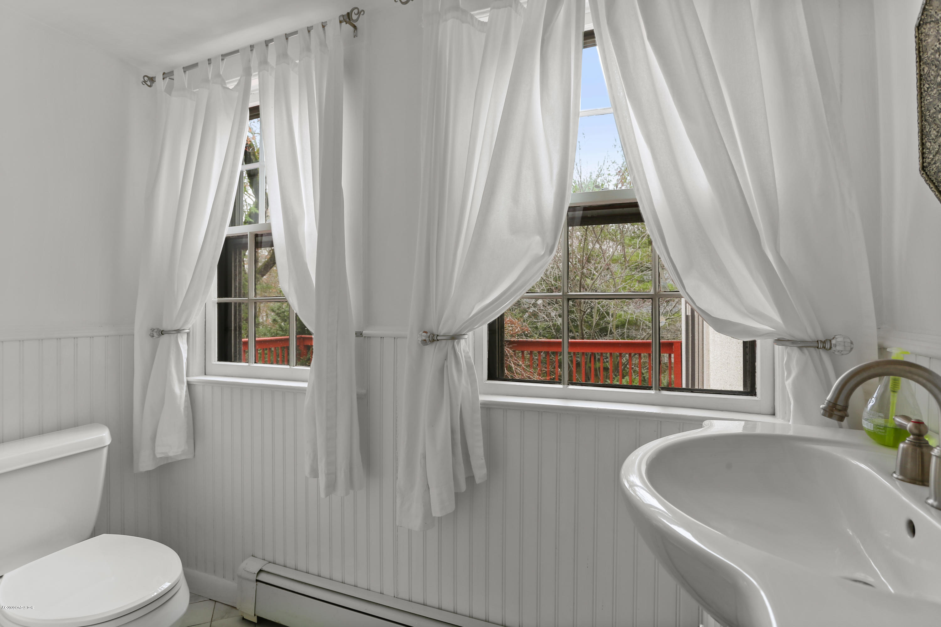 18 Leonard Avenue Riverside, CT 06878 - Photo 15 of 28 a bathroom with a sink and a window