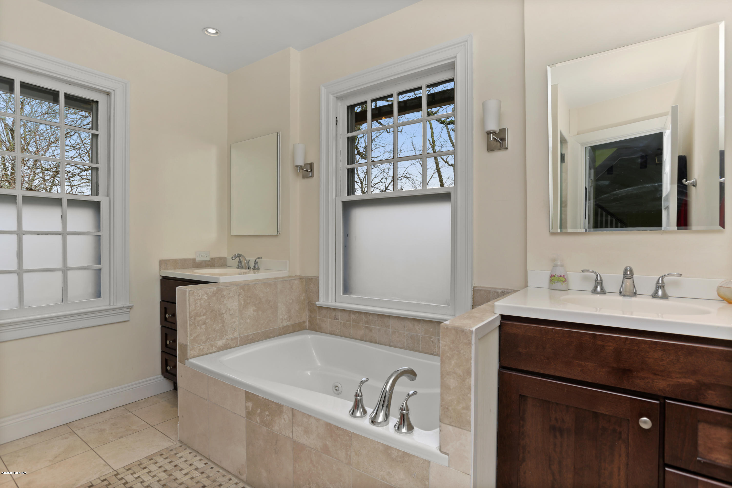 18 Leonard Avenue Riverside, CT 06878 - Photo 19 of 28 a bathroom with a bathtub sink and mirror