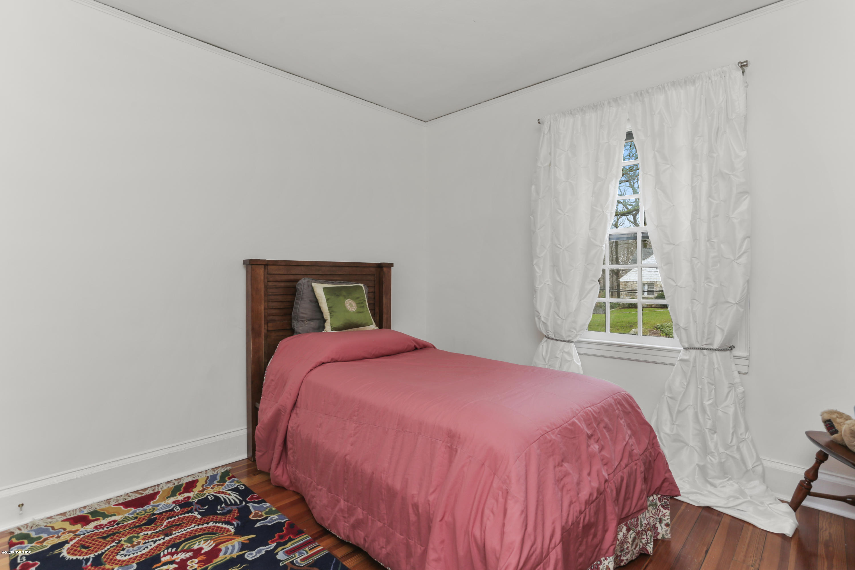 18 Leonard Avenue Riverside, CT 06878 - Photo 21 of 28 a bedroom with a bed and a window