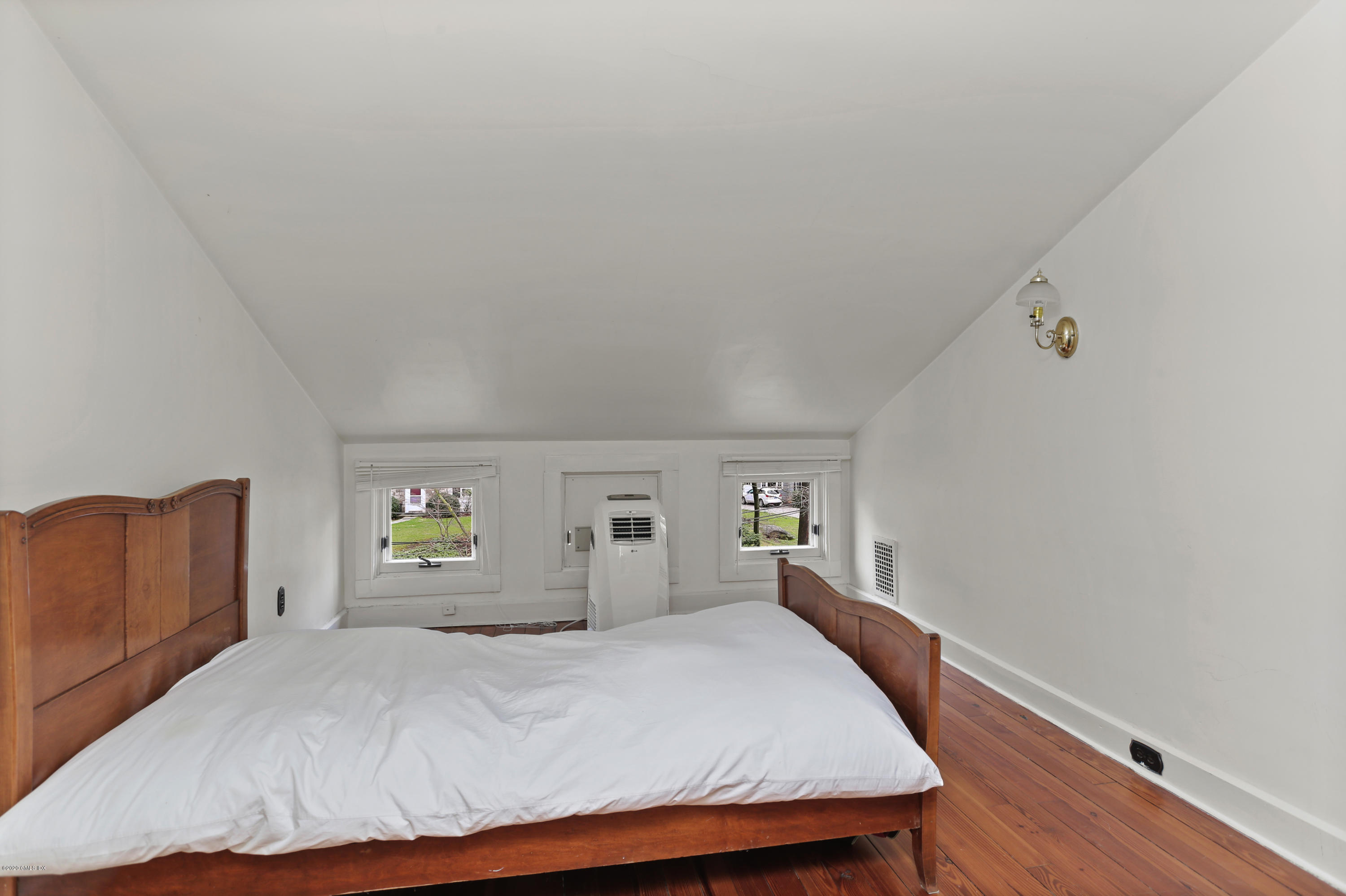 18 Leonard Avenue Riverside, CT 06878 - Photo 24 of 28 a bedroom with a bed and wooden floor