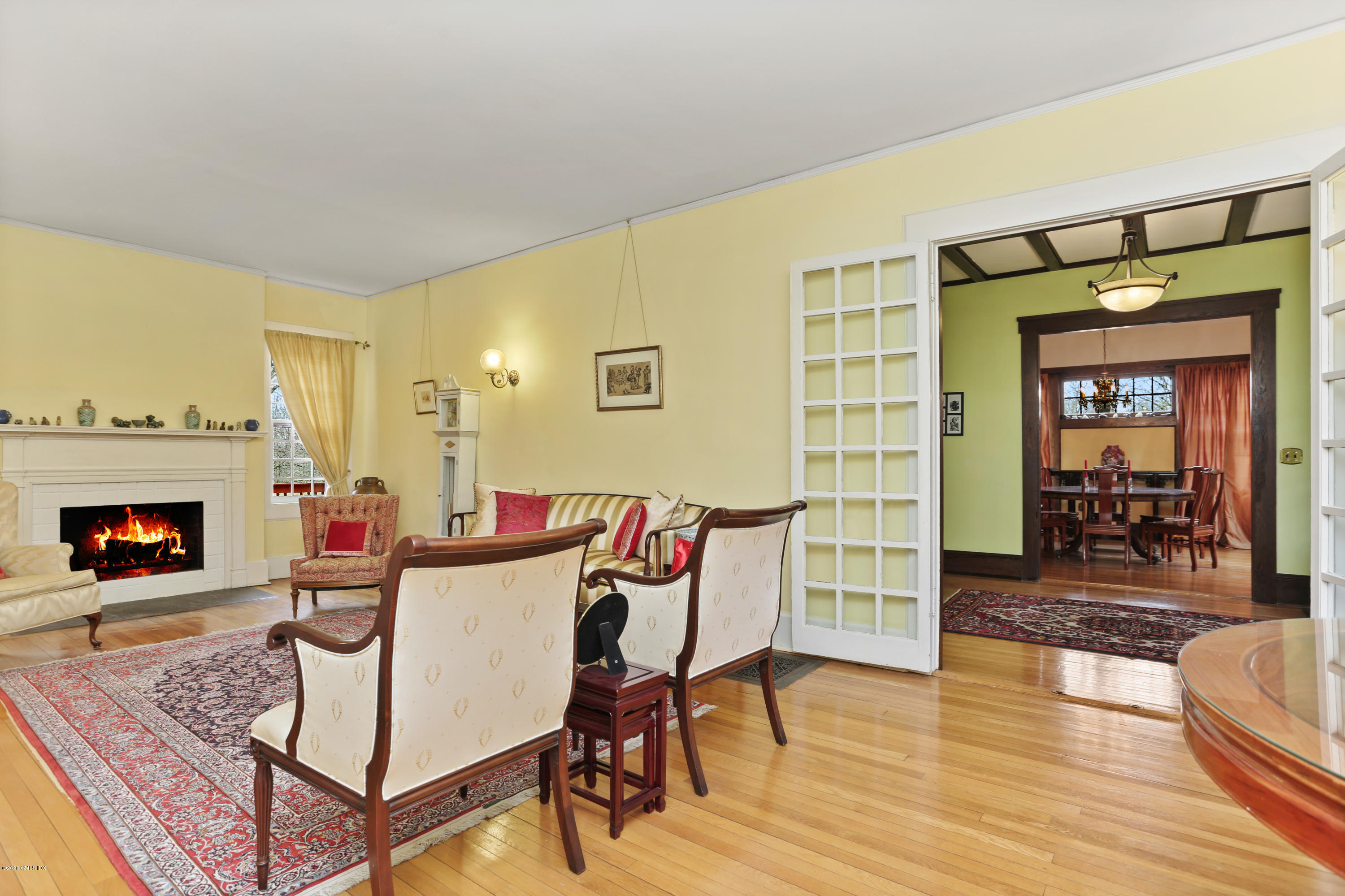 18 Leonard Avenue Riverside, CT 06878 - Photo 4 of 28 a view of a livingroom with furniture and a fireplace