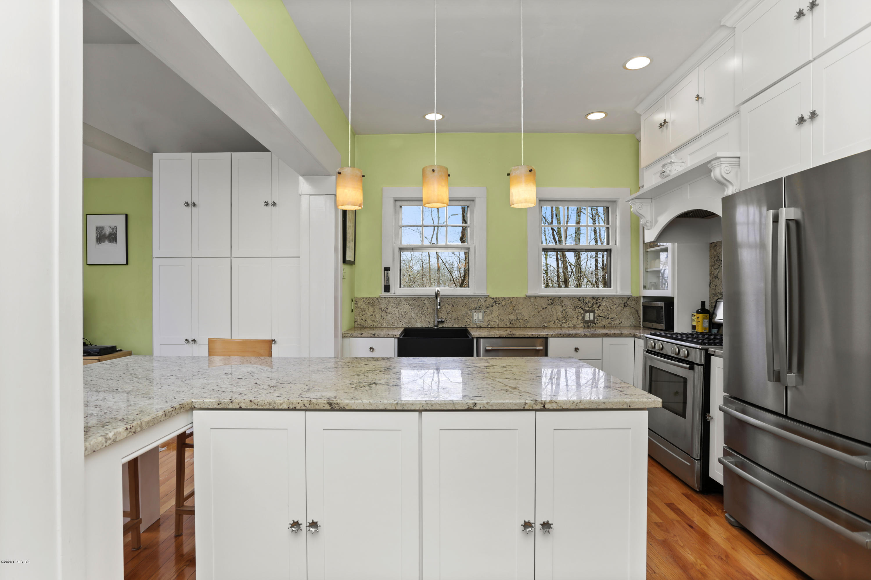 18 Leonard Avenue Riverside, CT 06878 - Photo 9 of 28 a kitchen with stainless steel appliances granite countertop a sink a stove and a refrigerator