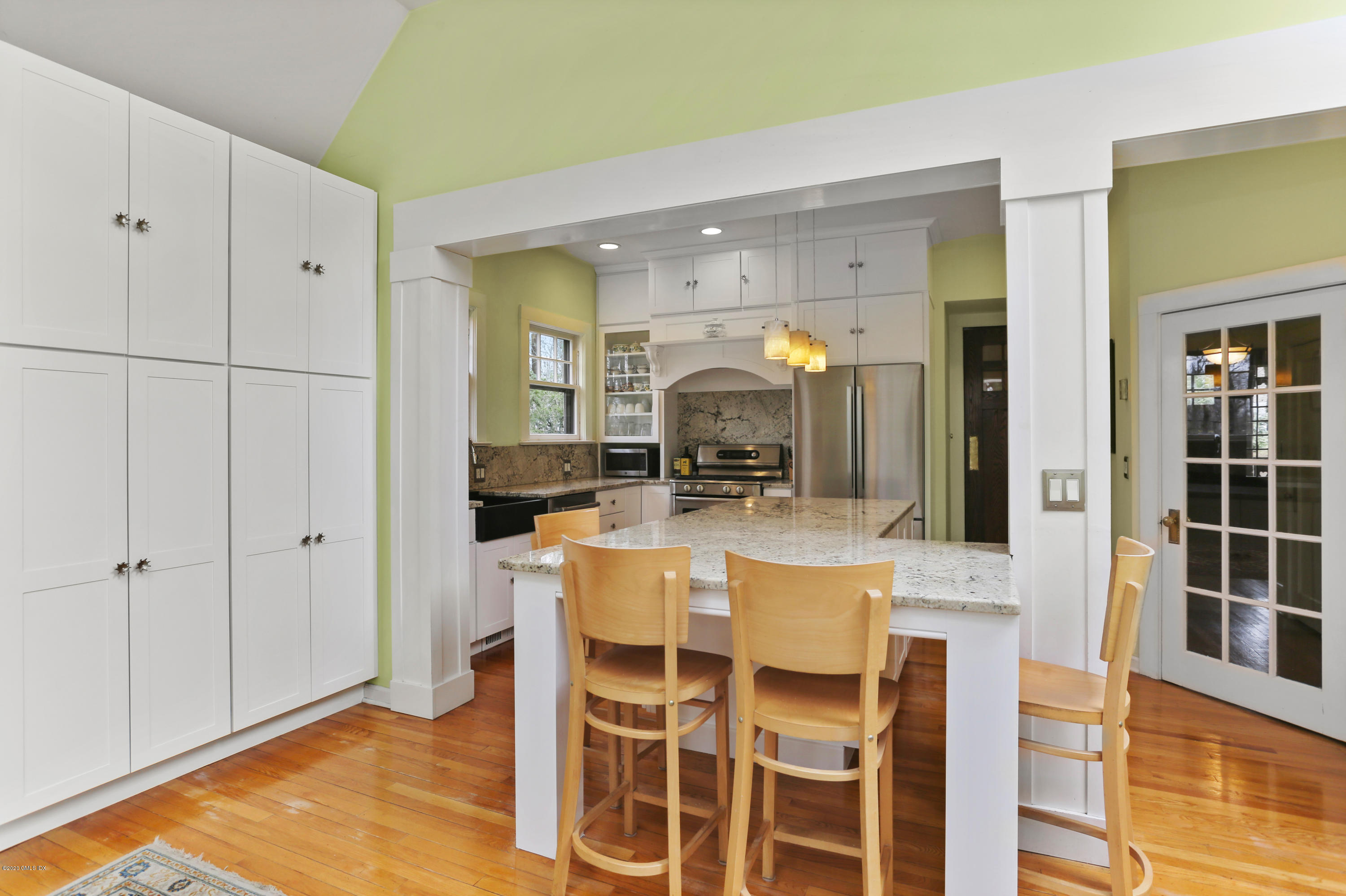 18 Leonard Avenue Riverside, CT 06878 - Photo 10 of 28 a view of a kitchen with dining table and appliances
