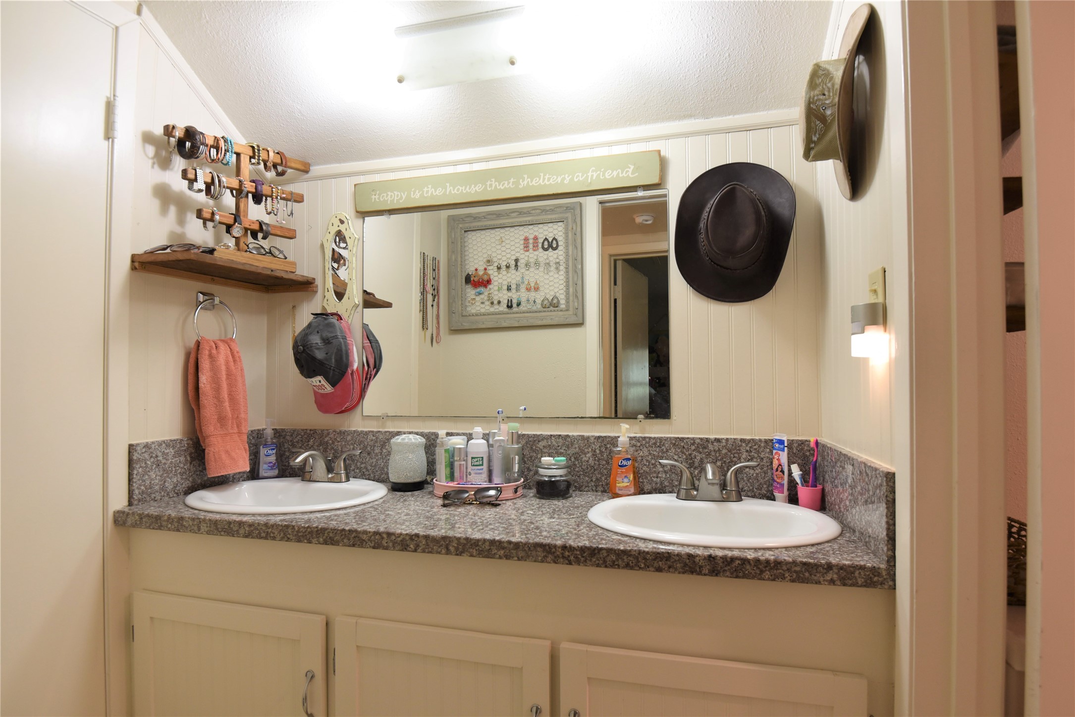 2231 US 90 Schulenburg, TX 78956 - Photo 16 of 31 a bathroom with a granite countertop sink a mirror and vanity