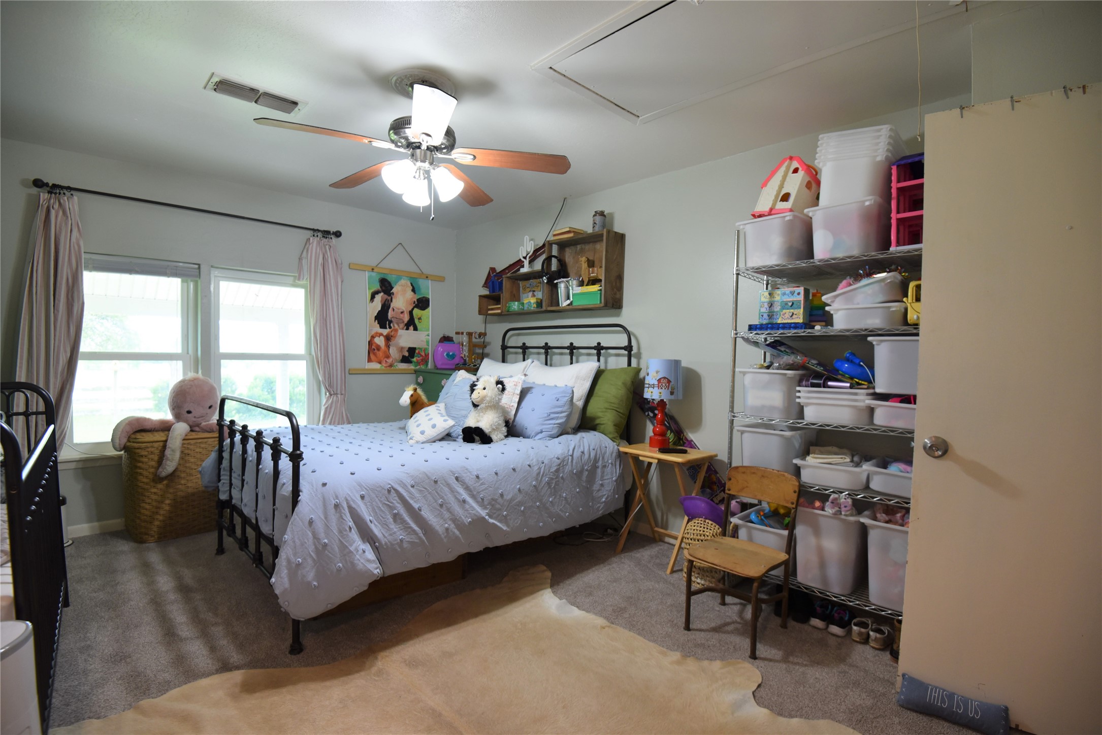 2231 US 90 Schulenburg, TX 78956 - Photo 17 of 31 a bedroom with a bed and a chandelier